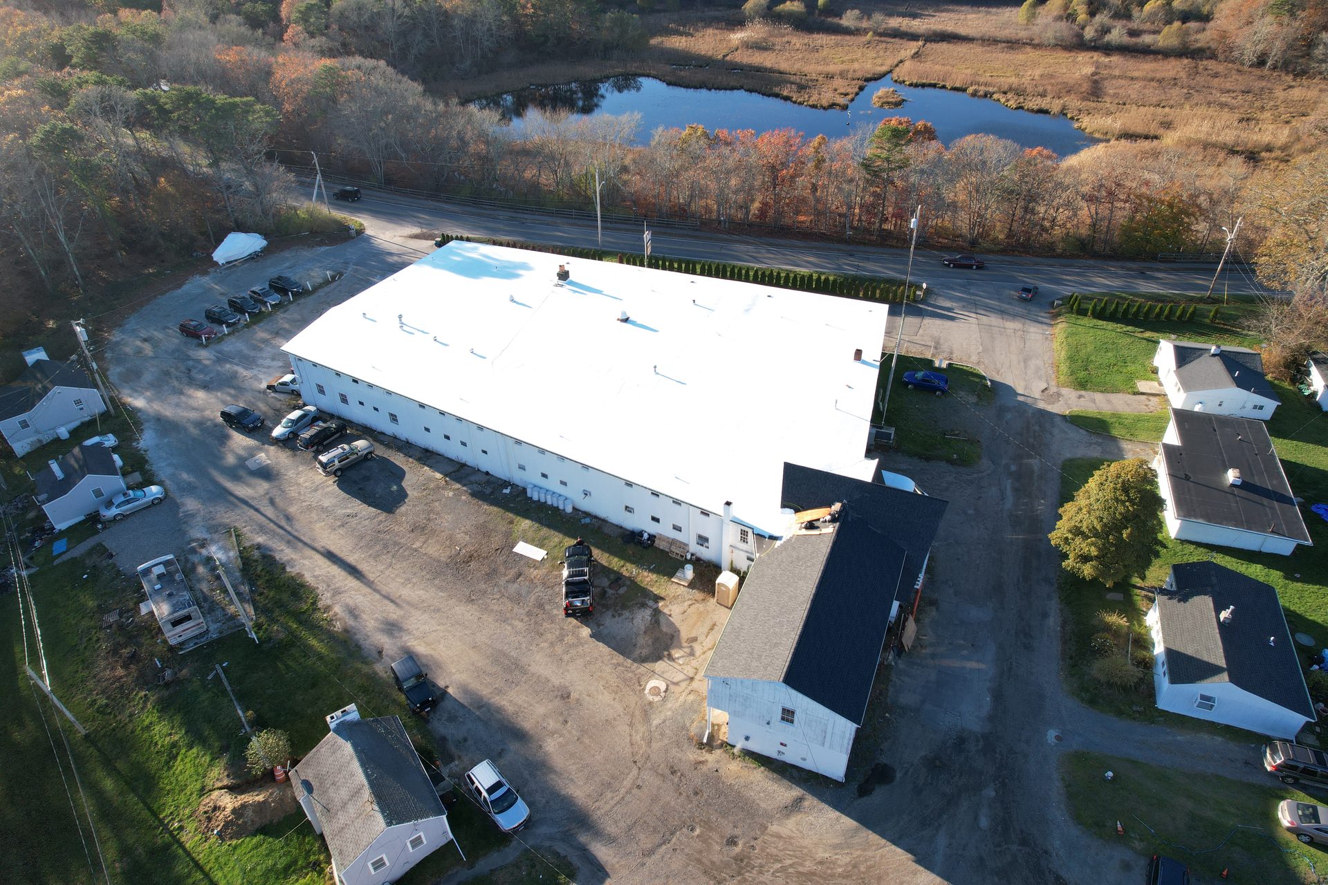 Completed commercial flat-roof aerial — HyTech Roofing, Cape Cod