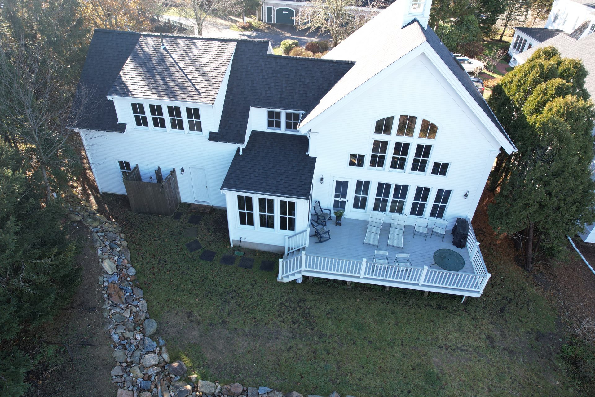 AZEK composite deck with integrated benches — HyTech Roofing, Cape Cod