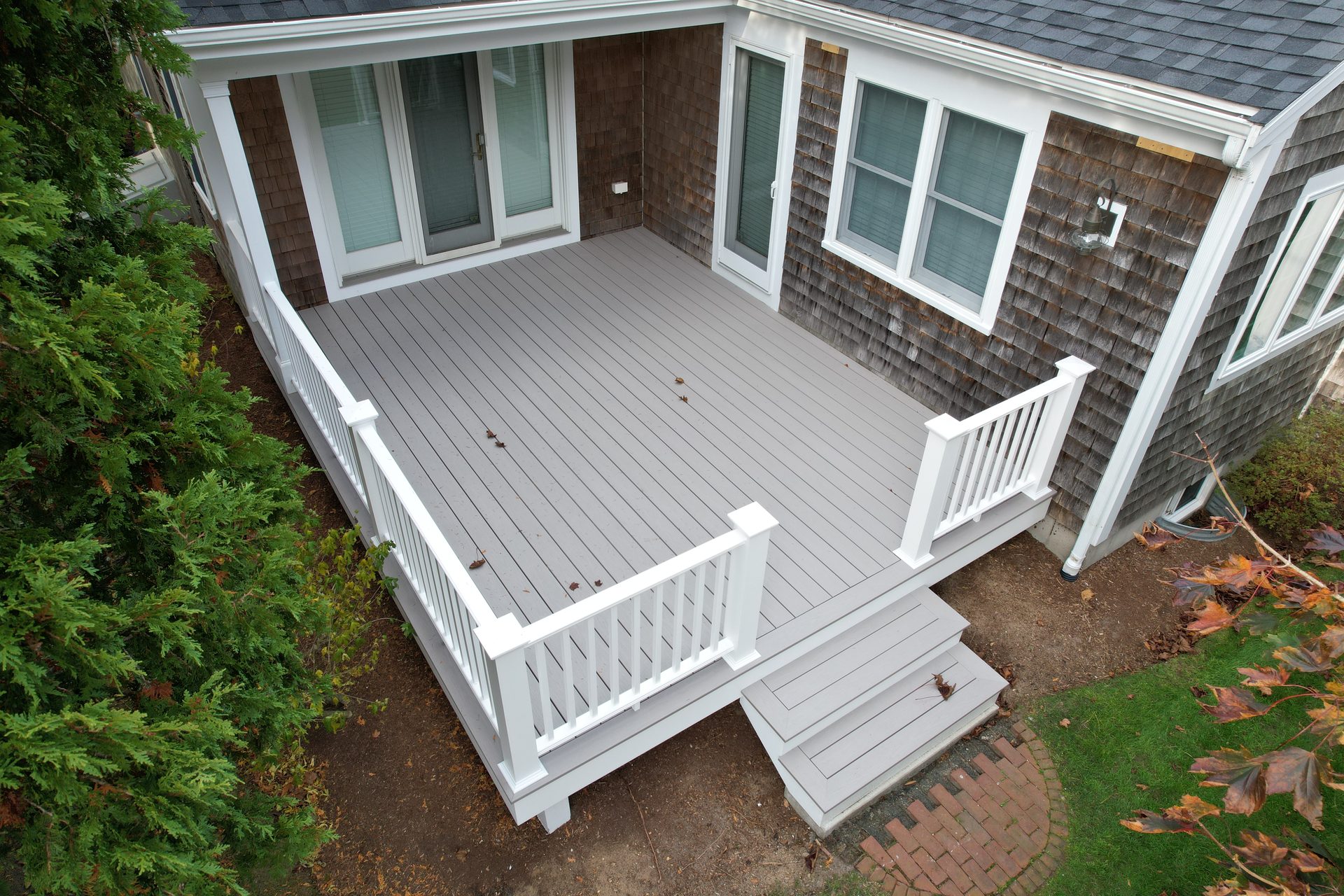 Curved waterfront deck — HyTech Roofing, Cape Cod
